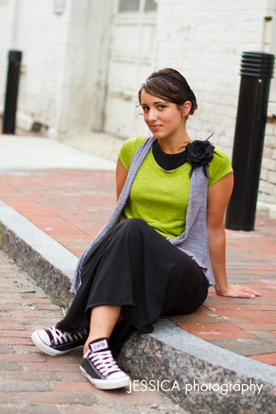 Senior Portrait of Janelle Yoder Urban Pose with Yellow Guard Rail