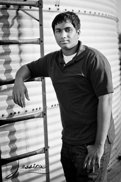 Senior Portrait of James Musunuri in the Country by Grain Bin