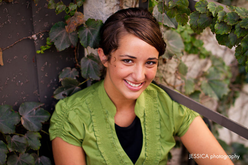 Senior Portrait of Janelle Yoder with Green Ivy on Fire Escape