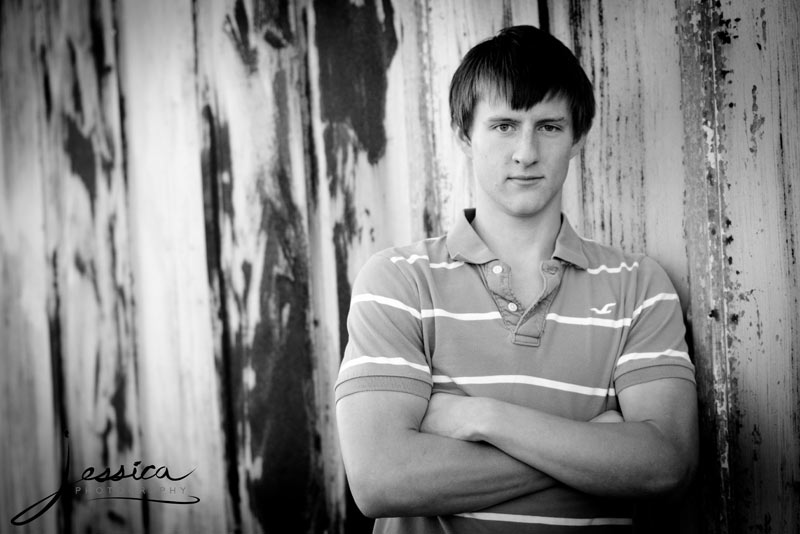 Senior Portrait of Luke Shetler with Old Barn in the Country