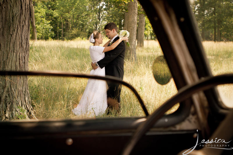 Wedding Pic of Allison & Zachary Gingerich with old truck