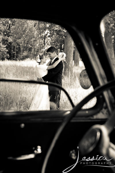 Wedding Pic of Allison & Zachary Gingerich with old truck