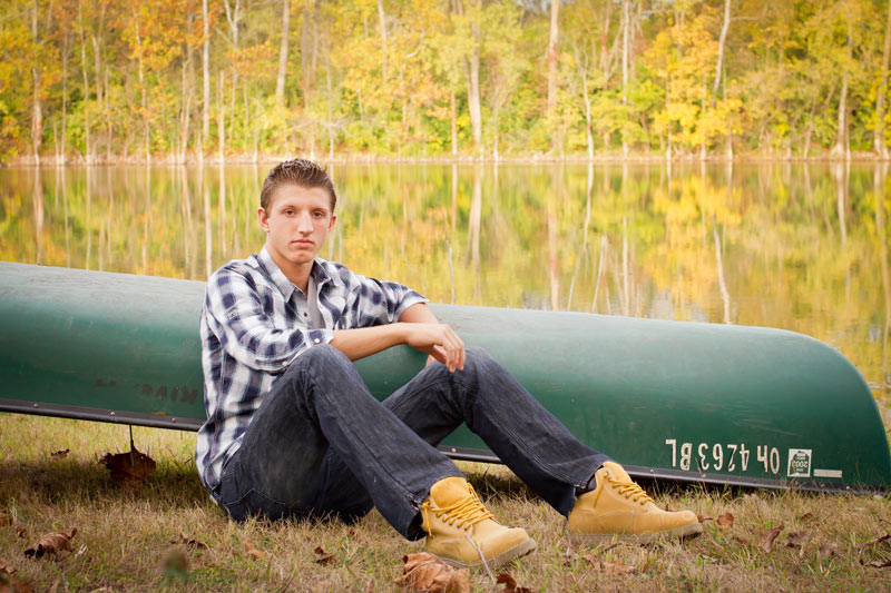 Senior Portrait of Tyler Headings with Canoe by Lake