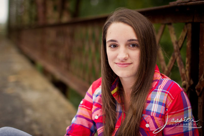 Senior Portrait of Michaela Hershberger on an old bridge