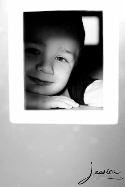 Pic of Child Looking Through a Window
