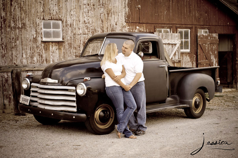 Engagement Pic of Drew Komer and Brittany Miller with an old truck