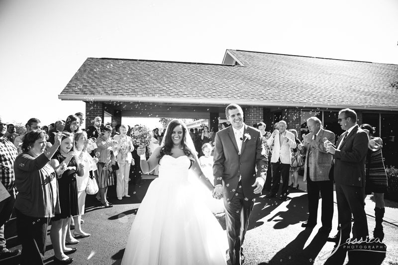 Picture of bride and groom leaving with bubbles