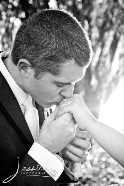 Picture of Groom kissing Bride's hand