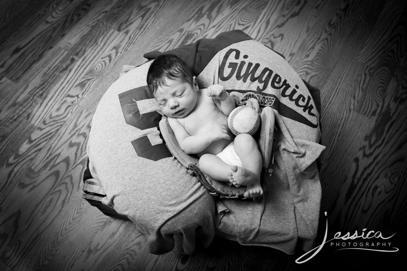 Newborn pic with baseball, glove and daddy's jersey