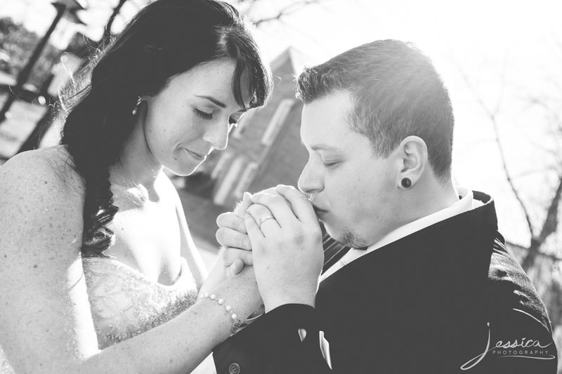 Picture of groom kissing bride's hand