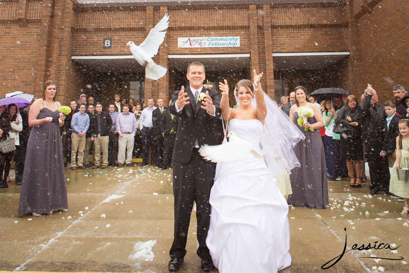 Bride and Groom with wedding doves release