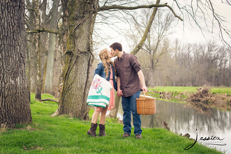 Picnic engagement pictures by a creek