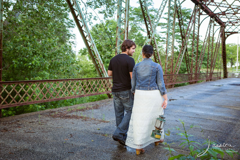 Holding hands on a bridge