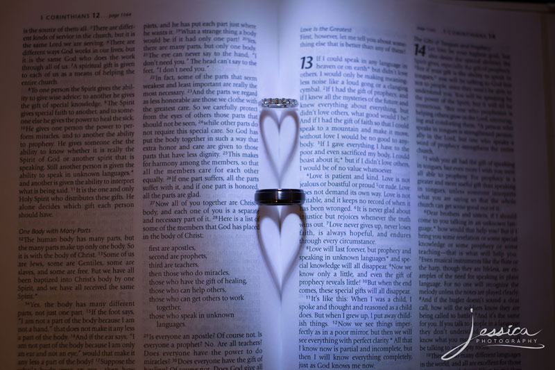 Wedding rings in a Bible with heart shadows picture
