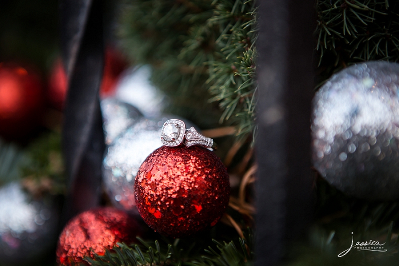 Picture of the engagement ring with Christmas ornaments